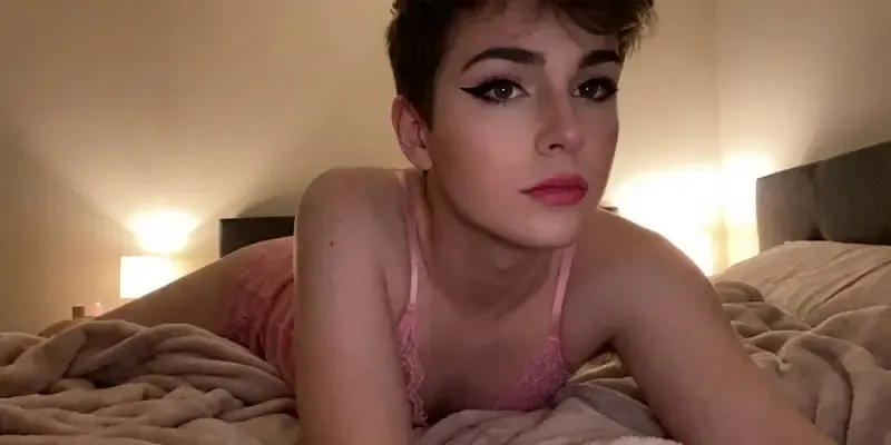 cute femboy in pink lingerie